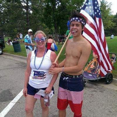 Runner with a flag-carrying companion.
